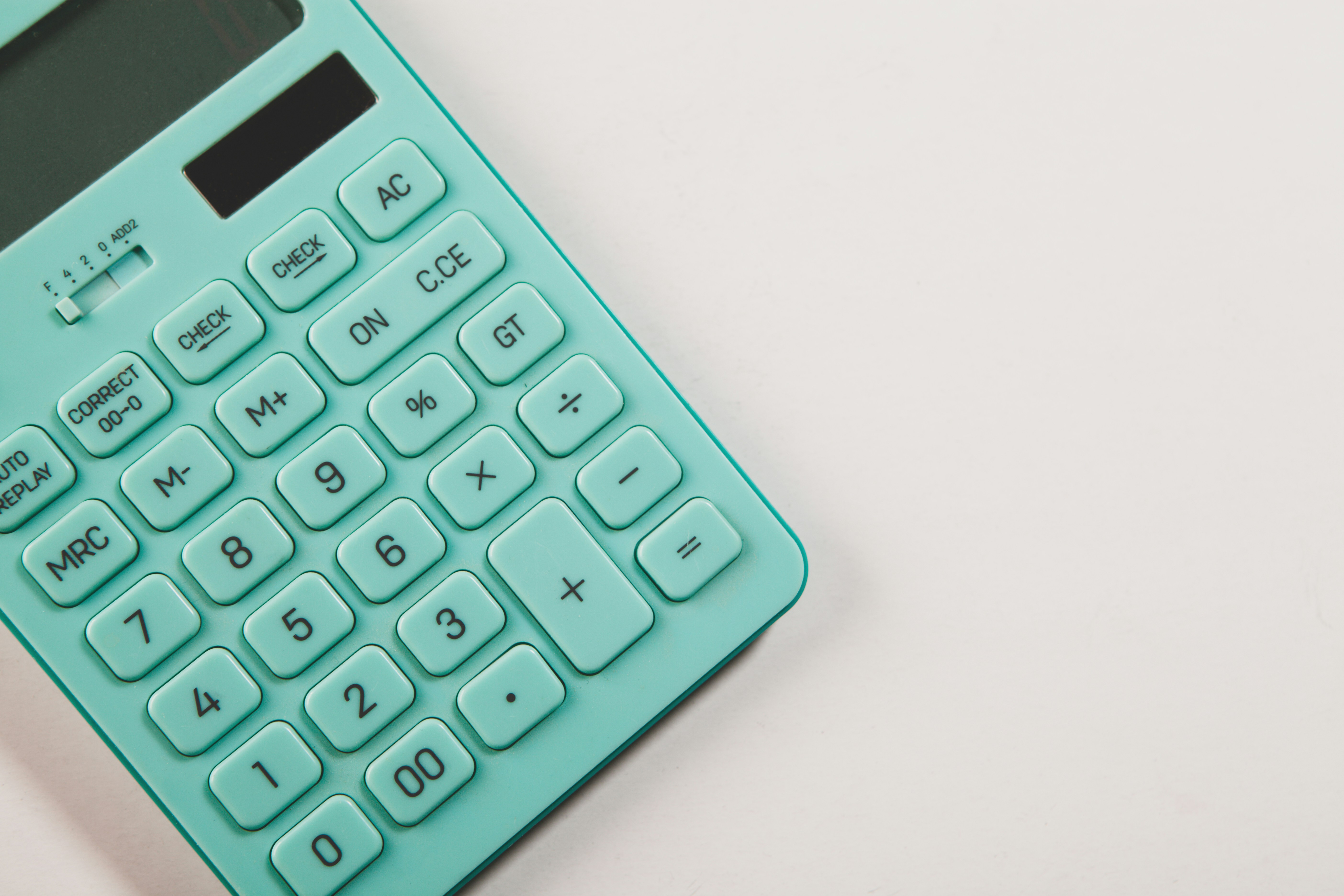 calculator on pink background. top view.